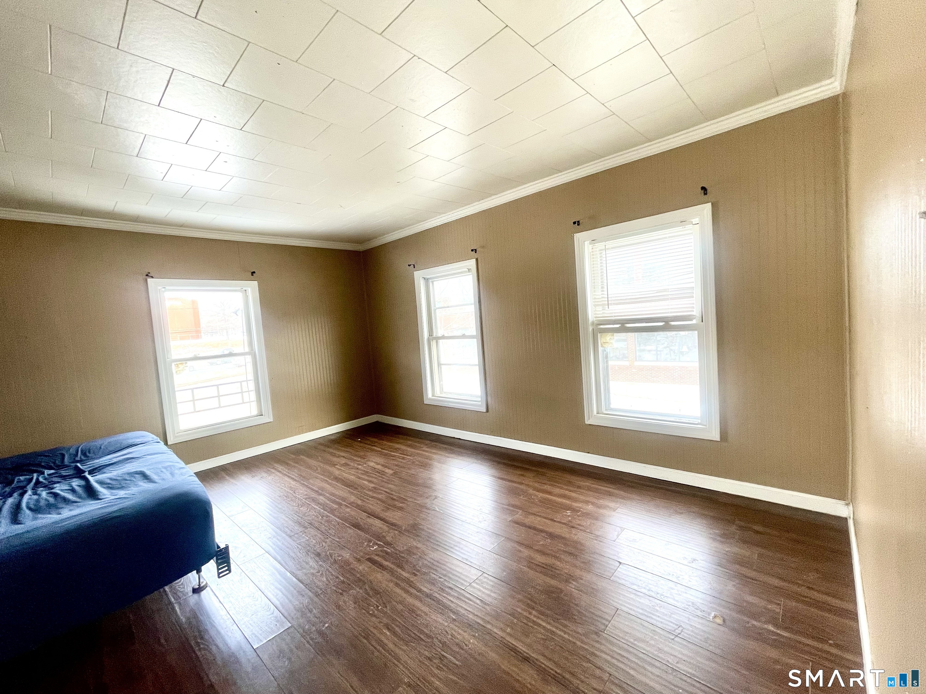 128 Franklin Street Waterbury, CT 06706 - Photo 24 of 25 a living room with hard wood floors and a window