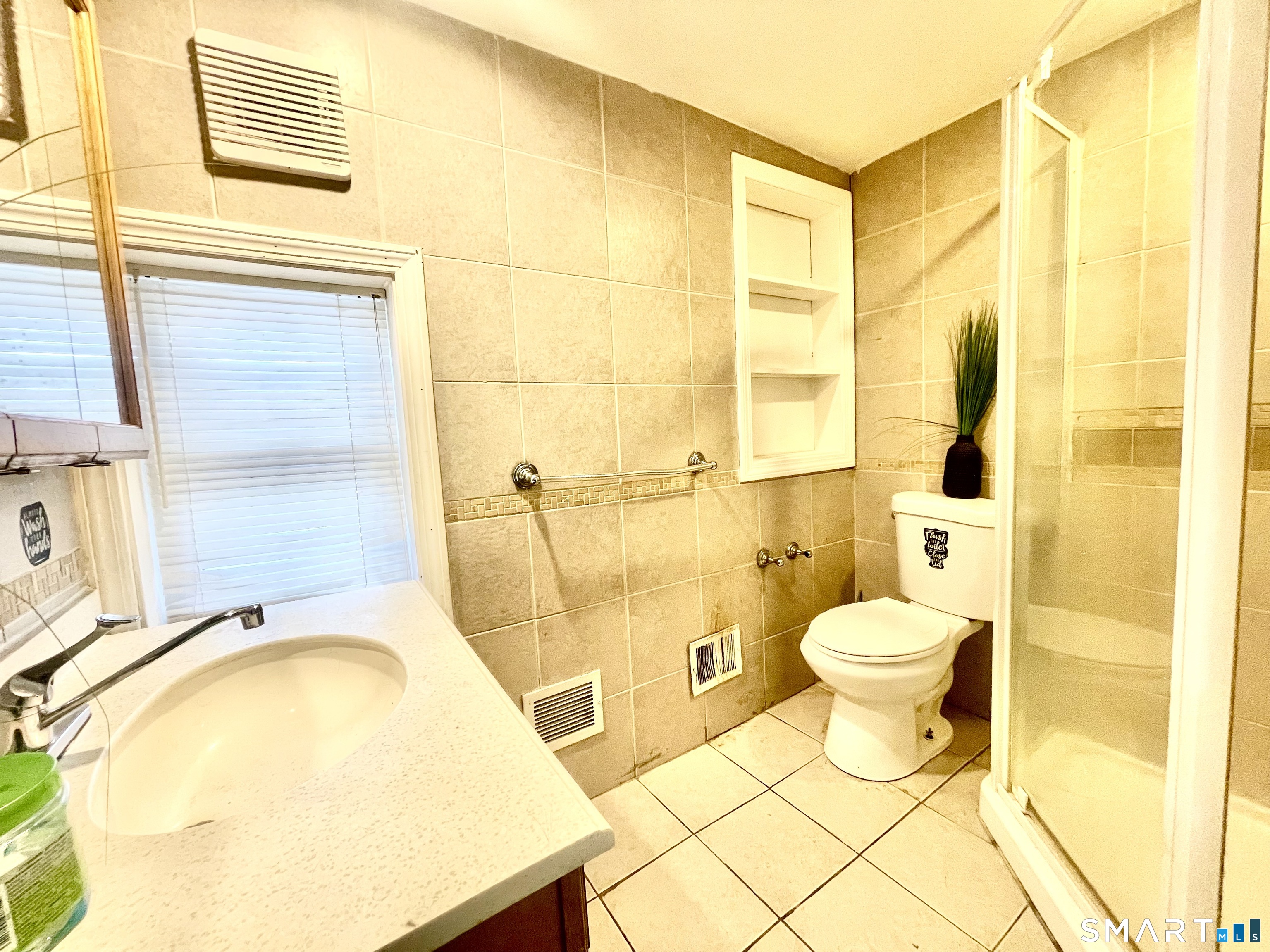 128 Franklin Street Waterbury, CT 06706 - Photo 10 of 25 a bathroom with a sink and a mirror