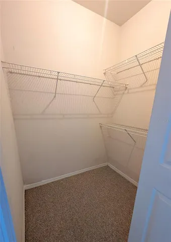 a view of a room with racks on the wall