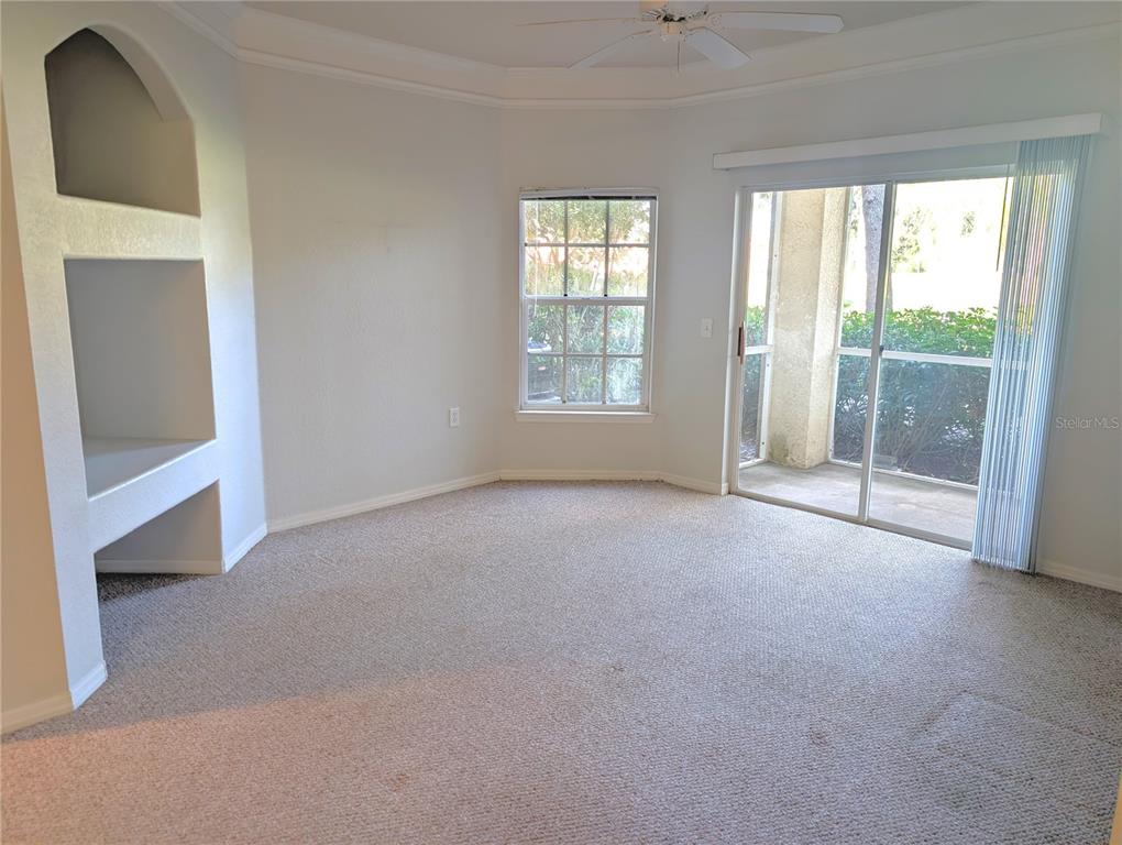5122 Northridge Road, Unit 110 Sarasota, FL 34238 - Photo 2 of 23 an empty room with windows