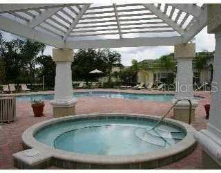5122 Northridge Road, Unit 110 Sarasota, FL 34238 - Photo 22 of 23 a view of a swimming pool with a patio