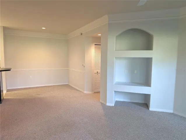 an empty room with a empty space and windows