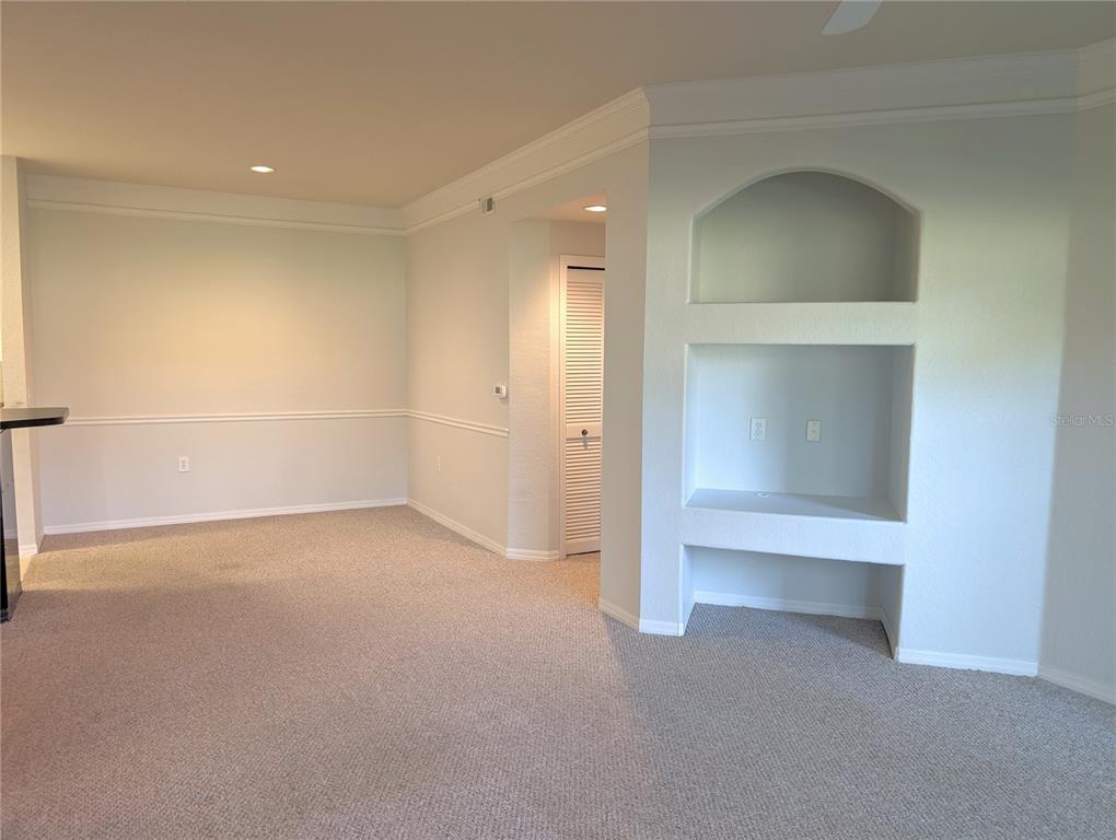 5122 Northridge Road, Unit 110 Sarasota, FL 34238 - Photo 3 of 23 an empty room with a empty space and windows