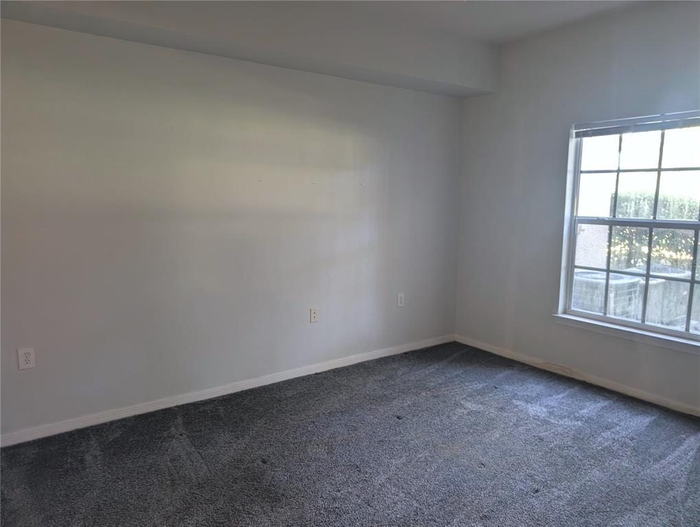 5122 Northridge Road, Unit 110 Sarasota, FL 34238 - Photo 9 of 23 an empty room with a window