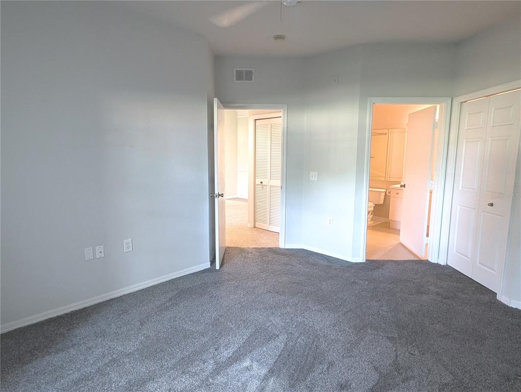 5122 Northridge Road, Unit 110 Sarasota, FL 34238 - Photo 10 of 23 a view of a big room with closet and windows