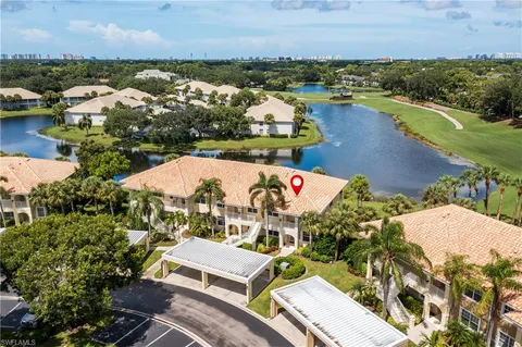 an aerial view of a house with a ocean view