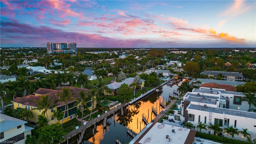 1560 Blue Point Avenue, Unit 3 Naples, FL 34102 - Photo 42 of 43 an aerial view of residential houses with city view