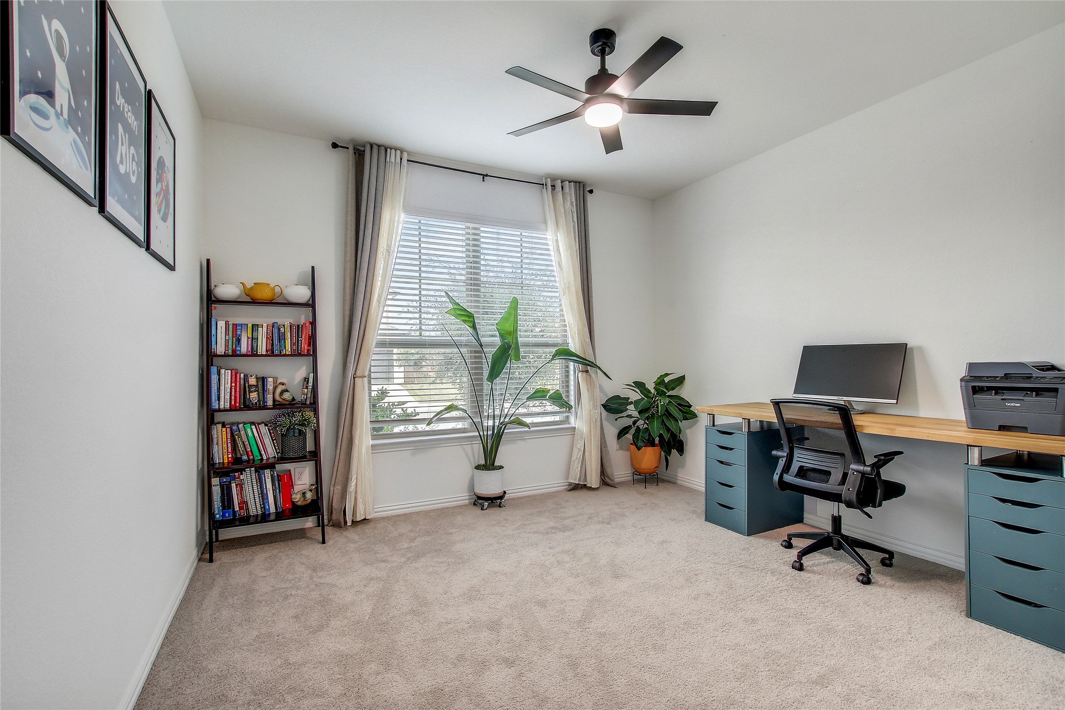 104 Millbend Road Georgetown, TX 78633 - Photo 4 of 40 A versatile space ready for a home office, featuring abundant natural light and soft carpeting.