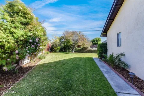 a front view of house with yard and trees