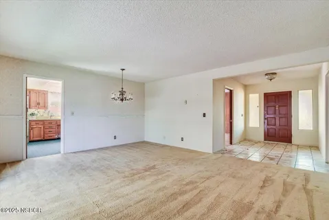 a kitchen with a sink cabinets stainless steel appliances and a window