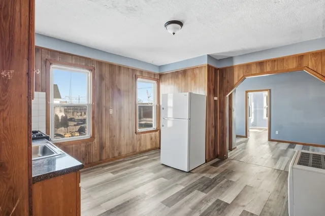 a view of hallway with furniture and windows
