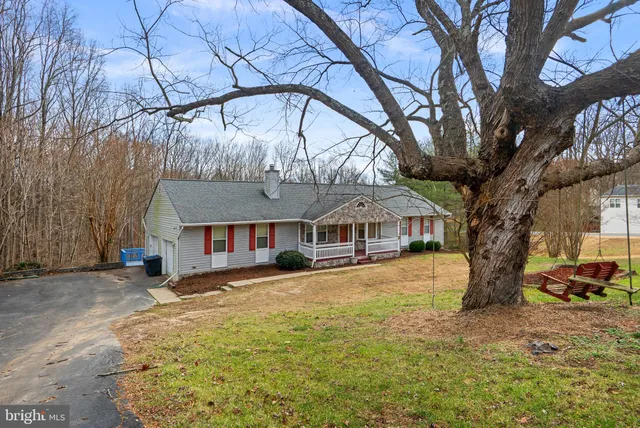a large tree in front of a house