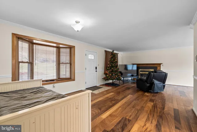 a living room with furniture fireplace and flat screen tv