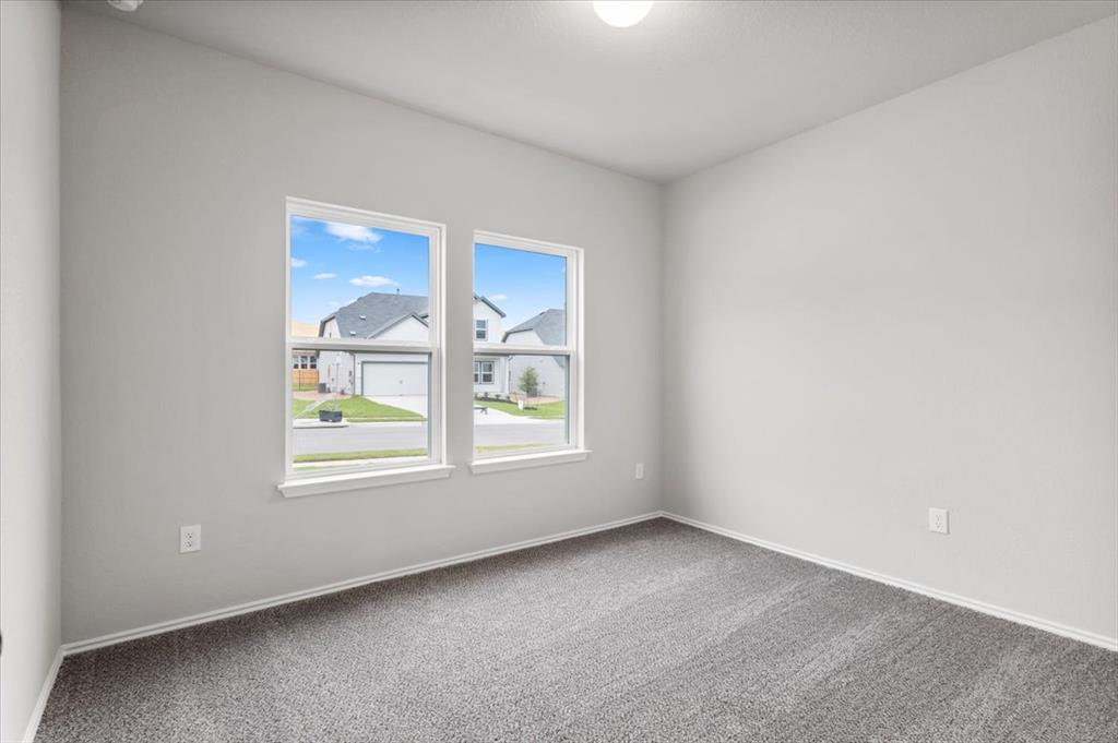 12212 Dillon Fls Drive Austin, TX 78747 - Photo 19 of 40 Carpeted spare room with baseboards