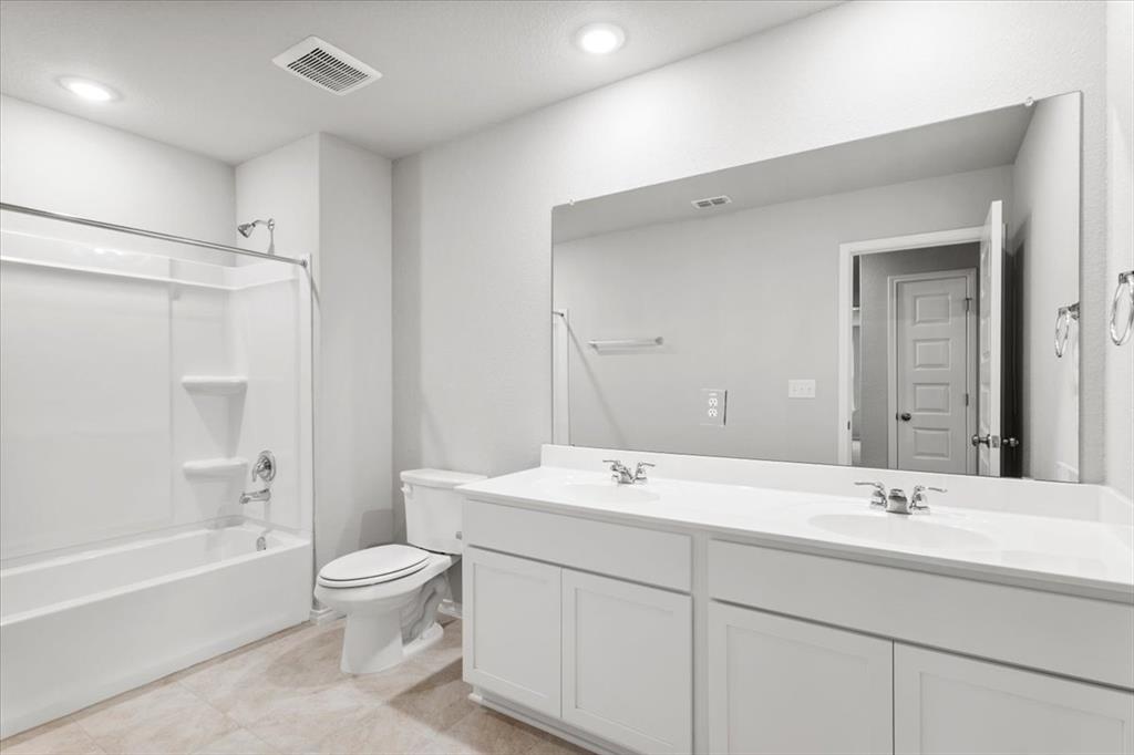 12212 Dillon Fls Drive Austin, TX 78747 - Photo 26 of 40 Bathroom with double vanity, shower / washtub combination, and recessed lighting