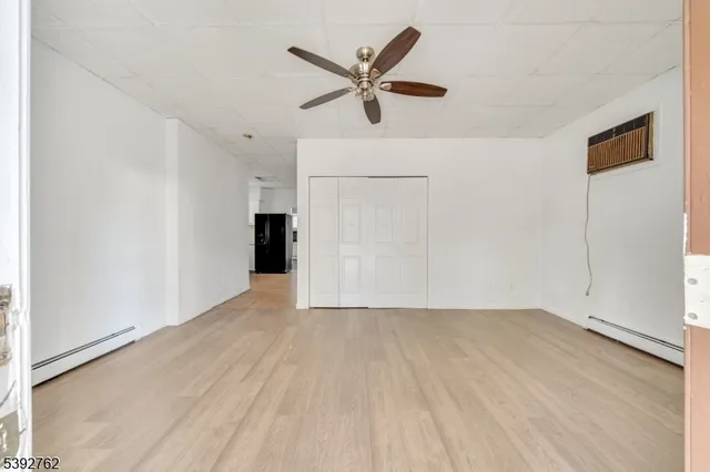 a kitchen with a refrigerator and a sink