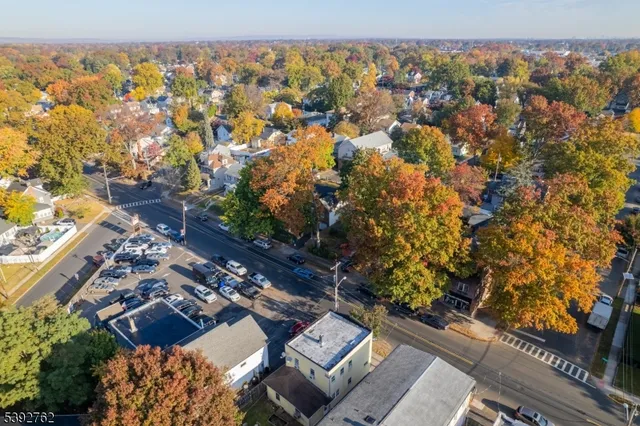 a view of room with hardwood floor and ceiling fan