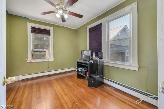 a view of a backyard with couches chair and wooden floor