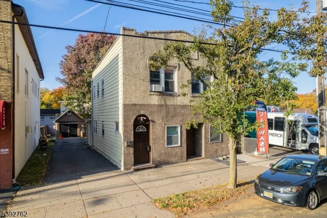 a view of a brick house with many windows
