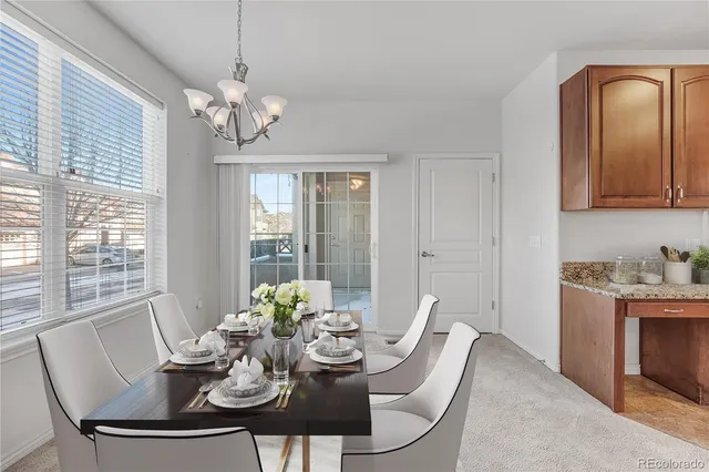 a view of a dining room with furniture window and outside view