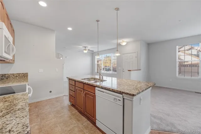 a kitchen with sink cabinets and window