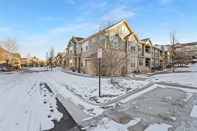 a view of a street with a building in the background