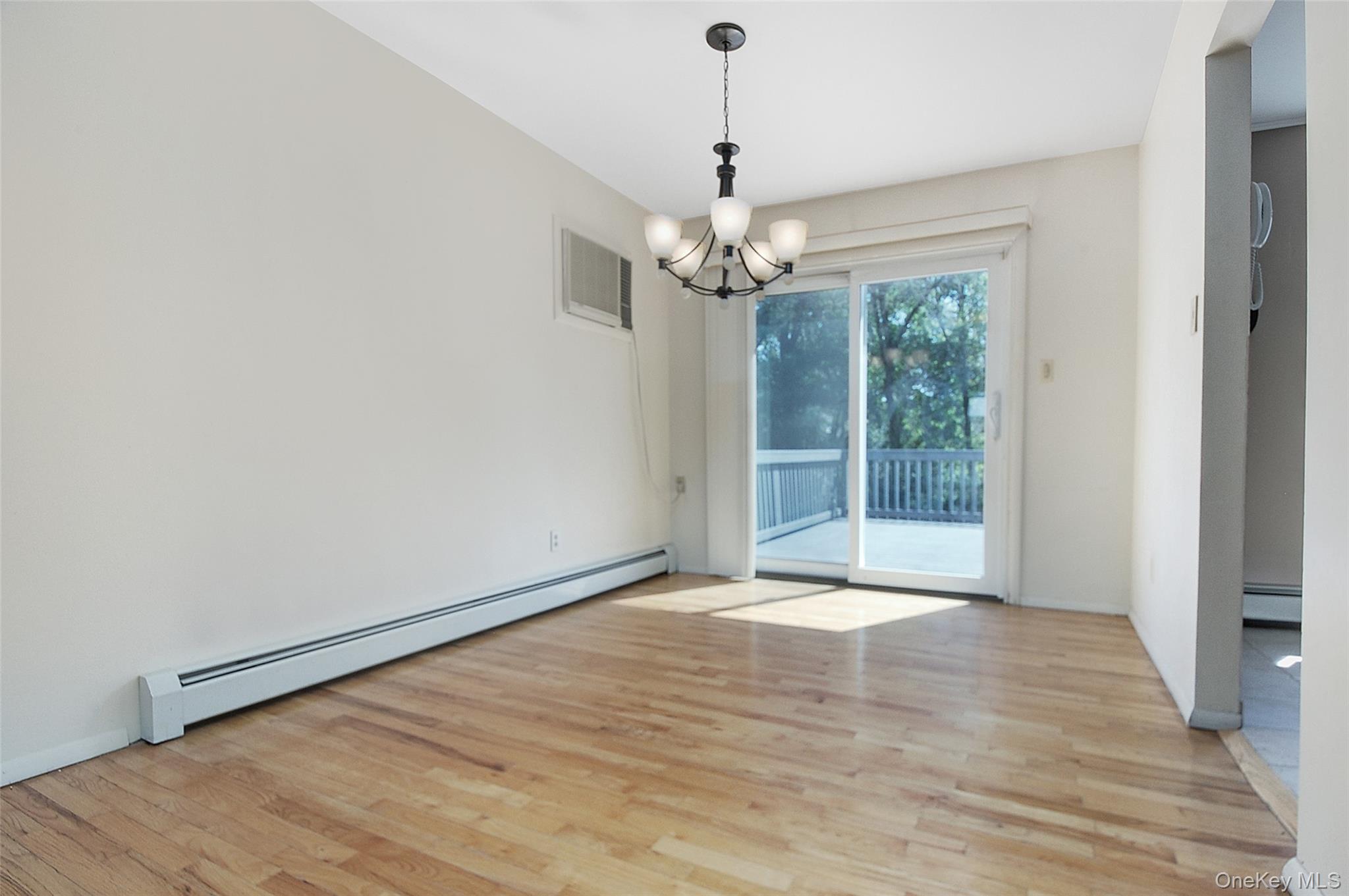 554 High Street Monroe, NY 10950 - Photo 12 of 29 a view of an empty room with wooden floor and a window