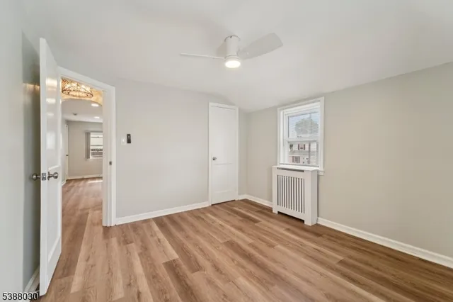 a view of a kitchen with wooden floor