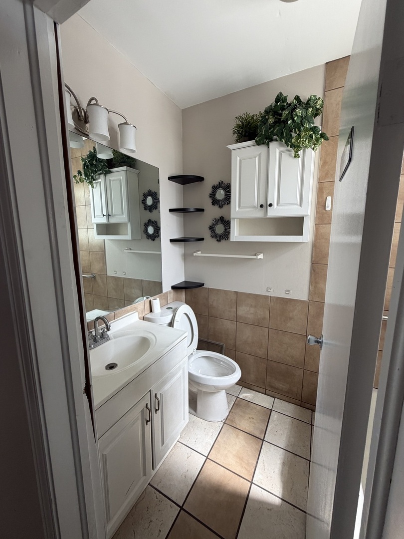 6551 West 63rd Street Chicago, IL 60638 - Photo 8 of 9 a bathroom with a sink toilet and shower