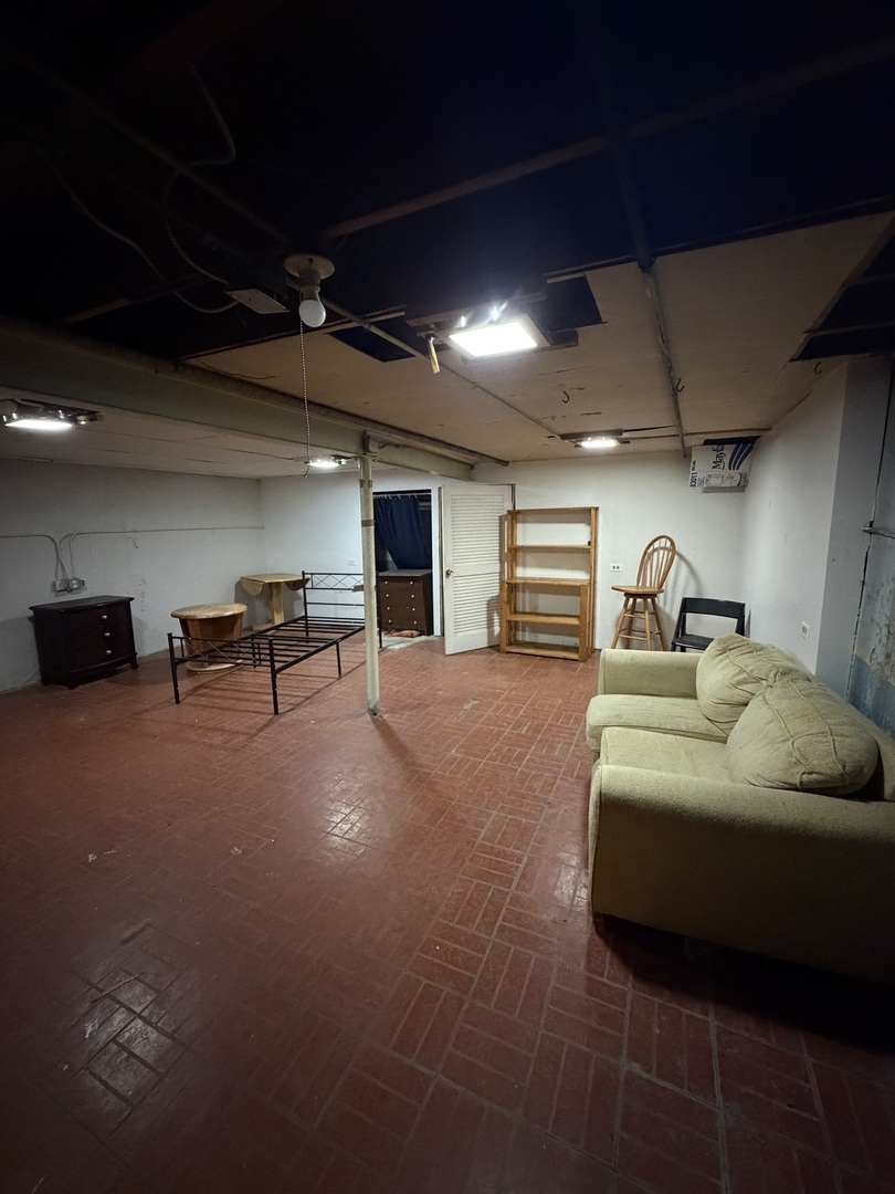 6551 West 63rd Street Chicago, IL 60638 - Photo 9 of 9 a bedroom with furniture and a car parked