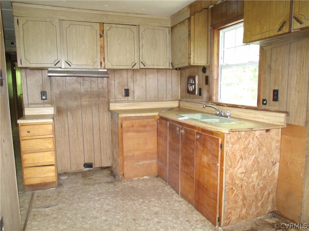 248 Skelton Road Victoria, VA 23974 - Photo 11 of 15 a kitchen with stainless steel appliances granite countertop a sink and a refrigerator