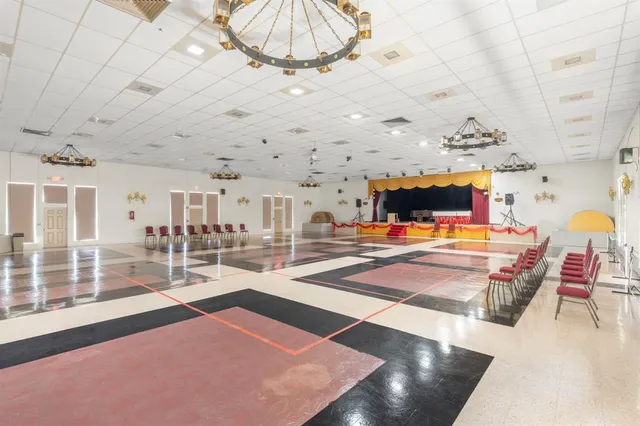 a view of a living room and chandelier