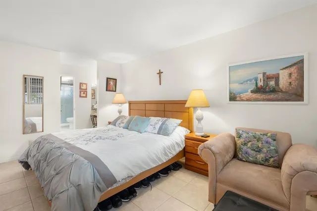 a bedroom with a bed and couch