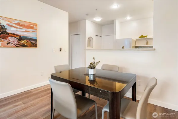 a view of a dining room with furniture and wooden floor