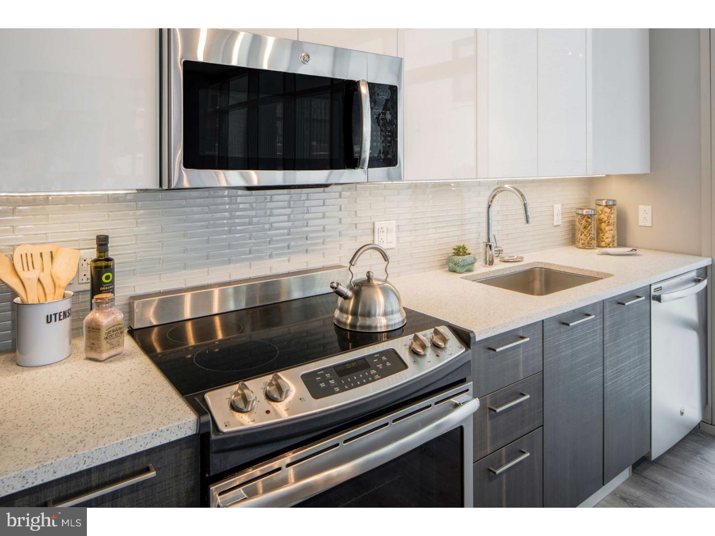 1213 Walnut Street, Unit 1B0301 Philadelphia, PA 19107 - Photo 3 of 10 a kitchen with a sink and cabinets