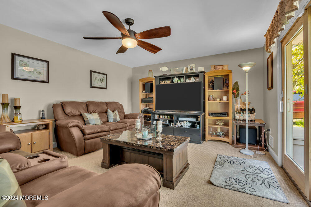 3 Ash Road Jackson, NJ 08527 - Photo 12 of 21 a living room with furniture and a flat screen tv