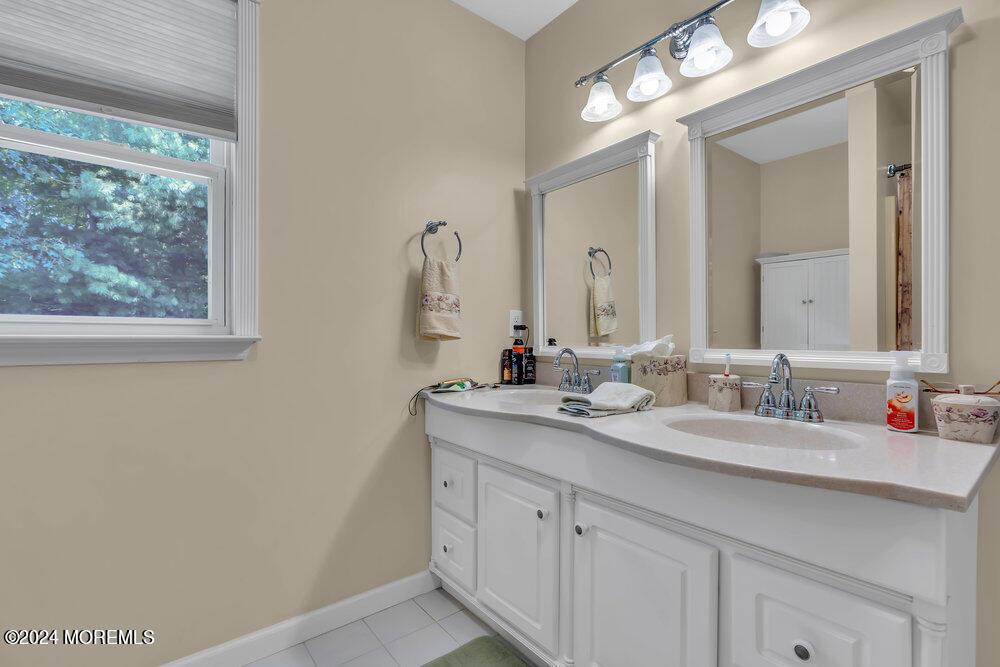 3 Ash Road Jackson, NJ 08527 - Photo 14 of 21 a bathroom with a double vanity sink and a mirror