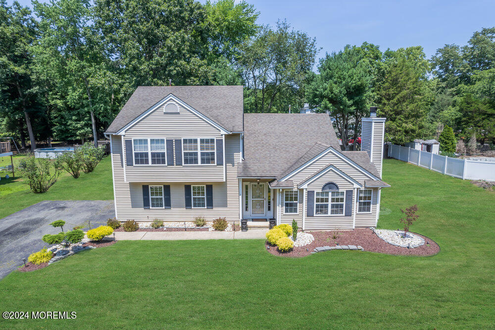 3 Ash Road Jackson, NJ 08527 - Photo 3 of 21 a front view of a house with garden and trees