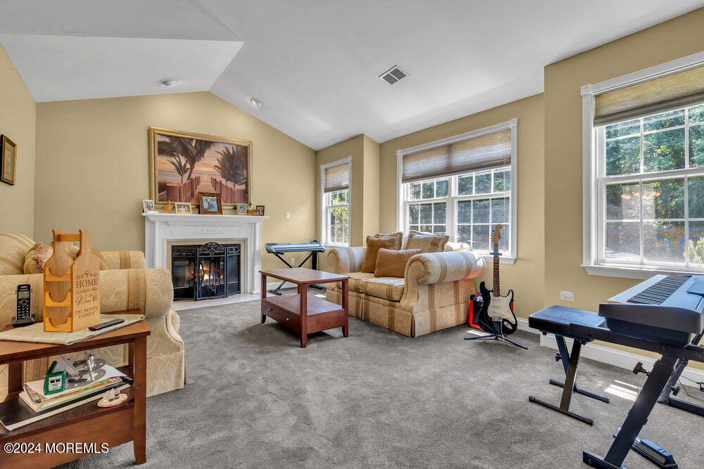 3 Ash Road Jackson, NJ 08527 - Photo 5 of 21 a living room with furniture and a fireplace