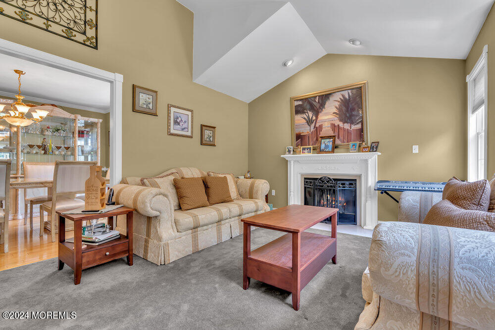 3 Ash Road Jackson, NJ 08527 - Photo 6 of 21 a living room with furniture a fireplace and a large window
