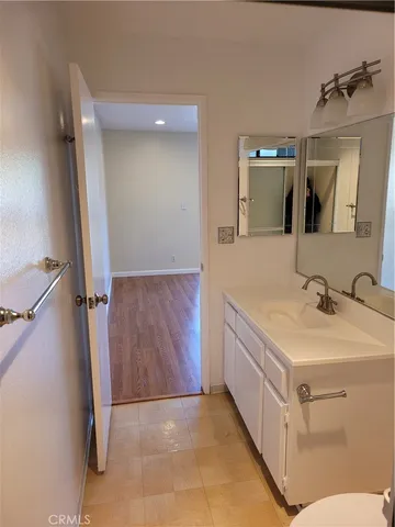 a bathroom with a sink and mirror