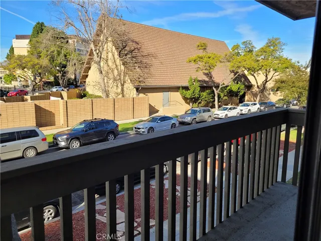 a view of street from balcony