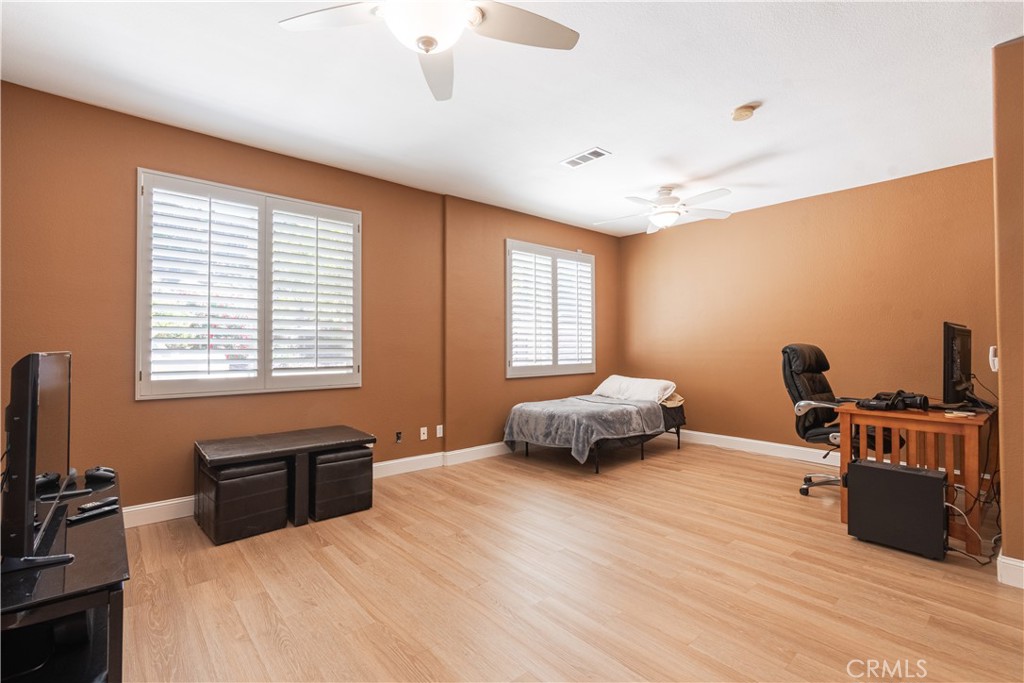 781 Angus Street Paso Robles, CA 93446 - Photo 16 of 34 Large downstairs bedroom with closet and door to the side yard, ceiling fan. This could be used as a private guest room with separate entrance.