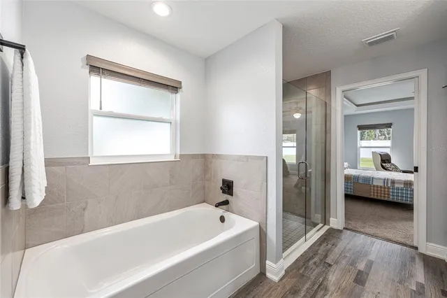 a bathroom with a bathtub and a sink