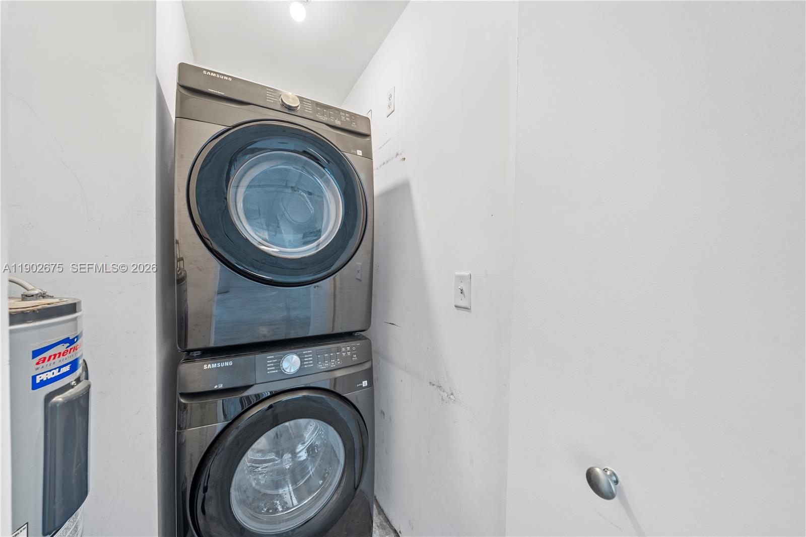444 Northeast 30th Street, Unit 702 Miami, FL 33137 - Photo 7 of 19 a utility room with dryer and washer