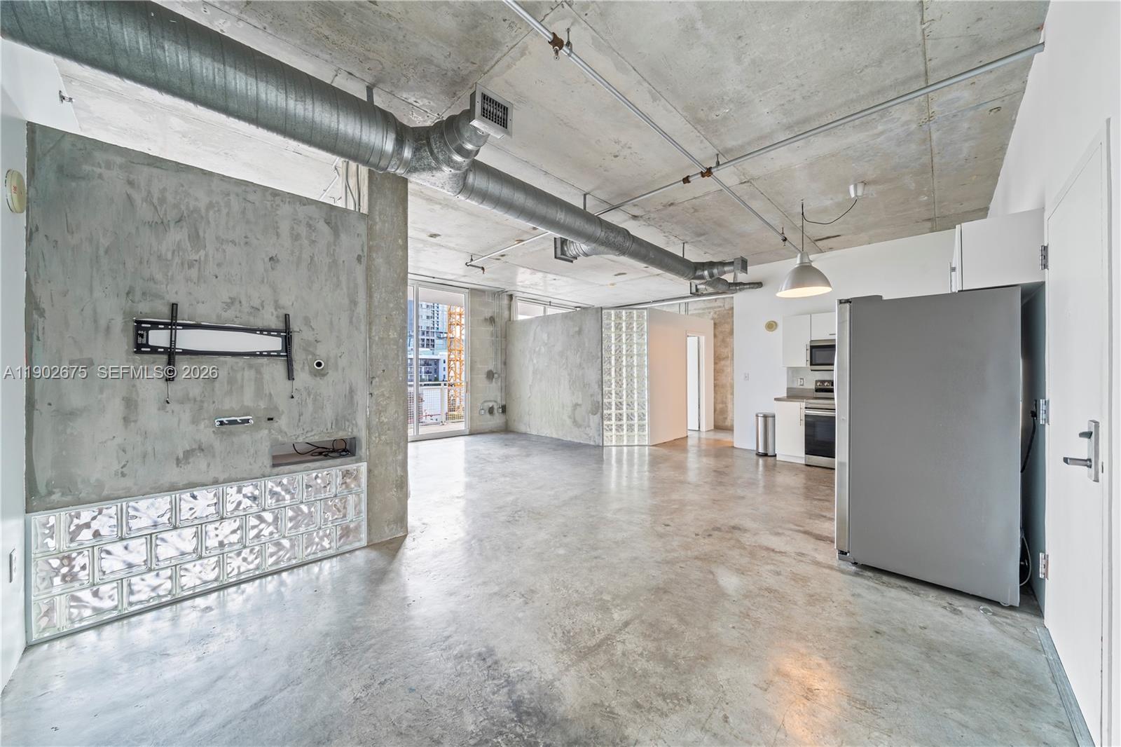 444 Northeast 30th Street, Unit 702 Miami, FL 33137 - Photo 8 of 19 a view of a hallway with a glass door shower