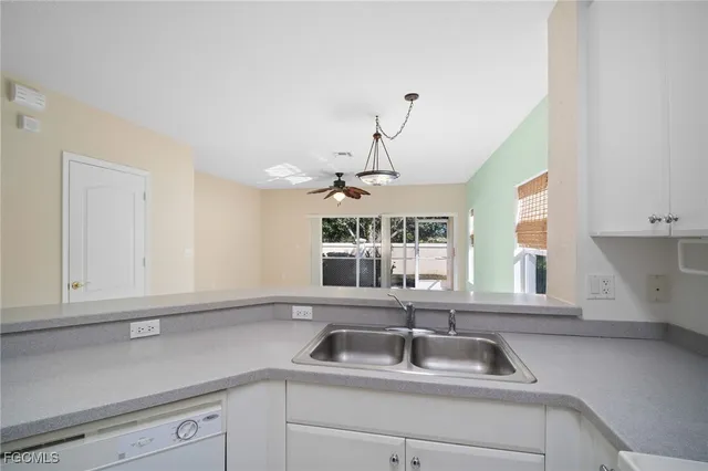 a kitchen with a sink and a window