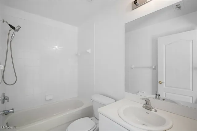 a bathroom with a sink a toilet and a bathtub
