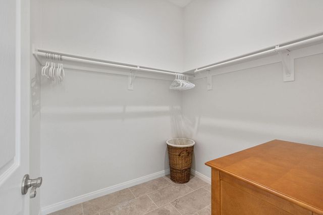 a room with water heater and a cabinet