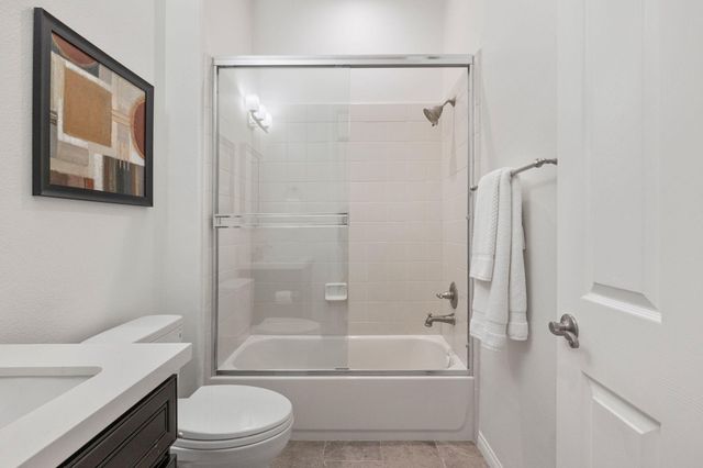 a bathroom with a toilet a sink and bathtub